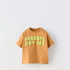 Kids Tan T-Shirt with Green Text parents day off
